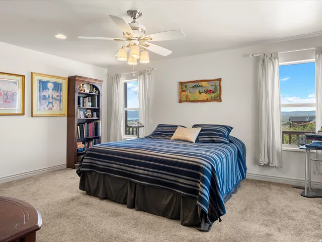 Spacious room featuring neutral carpet flooring and white walls