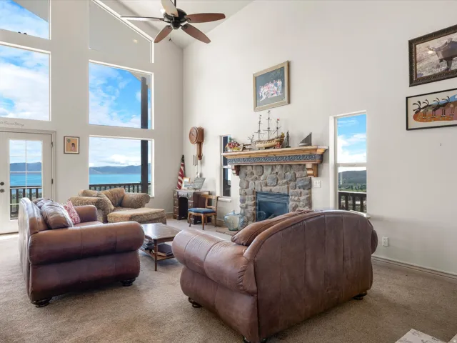 Living room featuring picture windows and water view