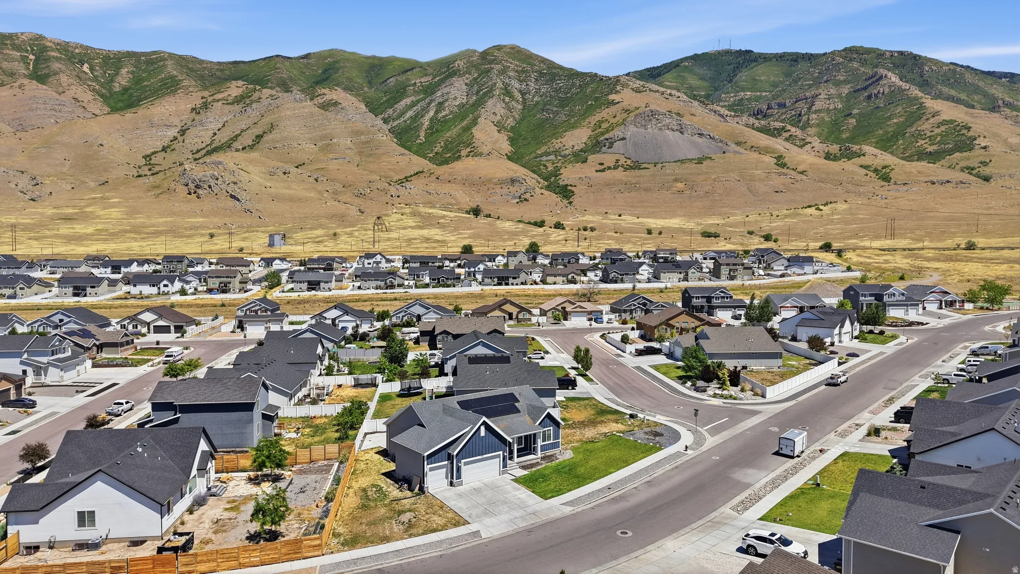 Newly developed residential community featuring a variety of architectural styles, paved streets, and landscaped yards