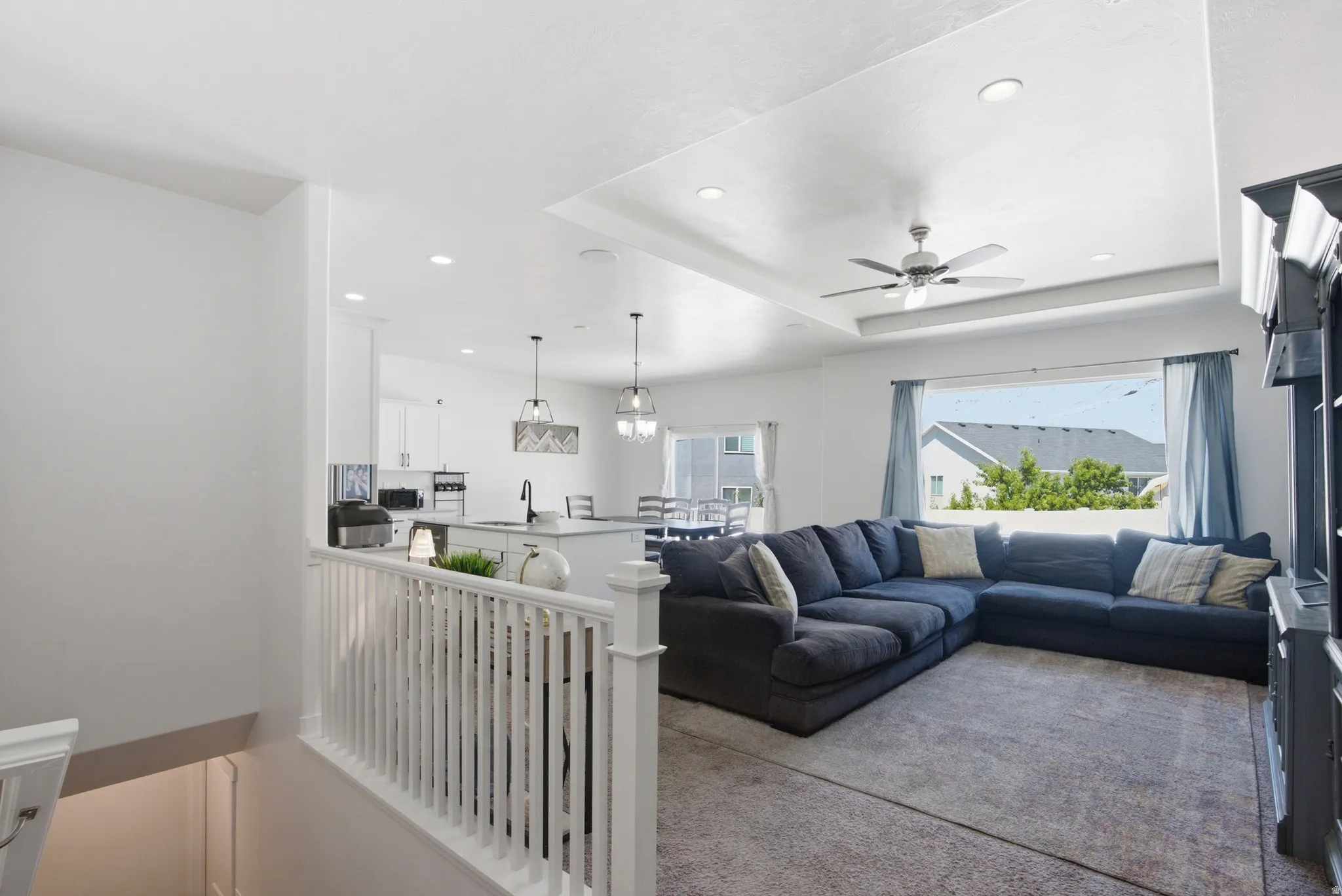 Open-concept living space featuring a spacious living room and kitchen