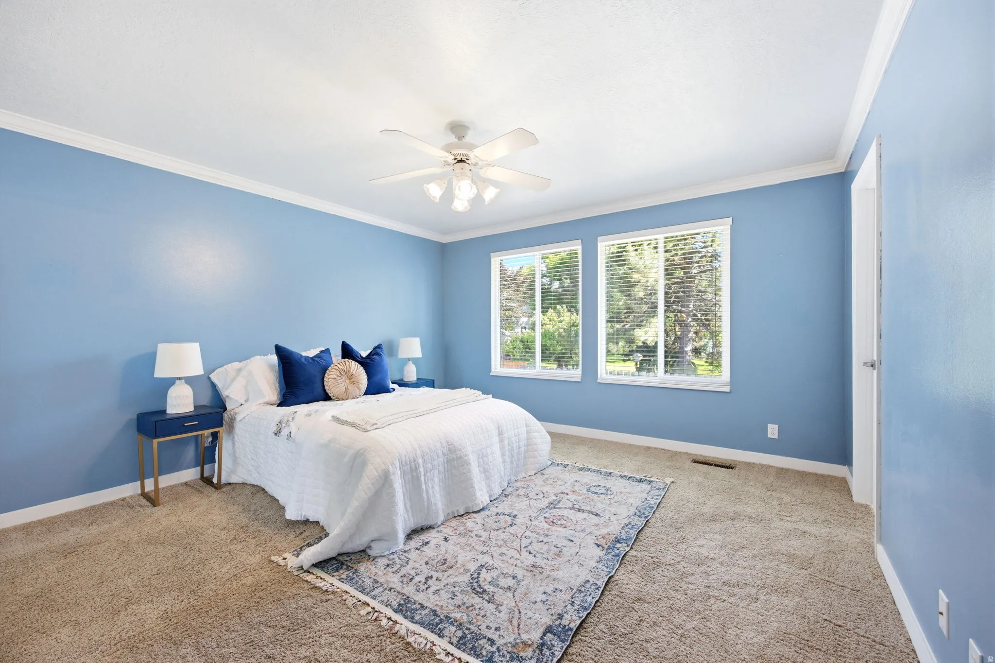 Light blue interior walls with white trim and crown molding