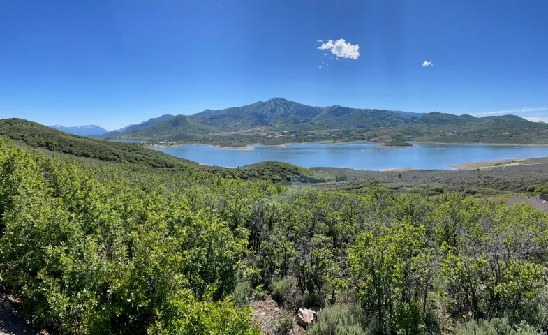 Expansive mountain and lake scenery with varied foliage