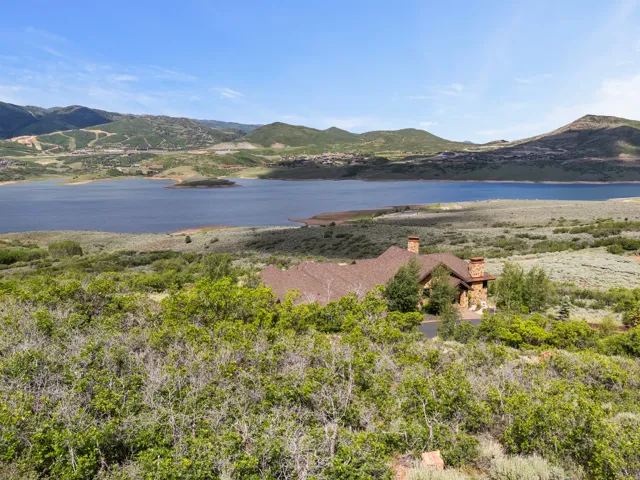 Stone and timber residence set amidst natural landscaping