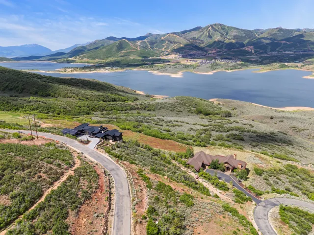 Rolling hillside property featuring two distinct architectural residences
