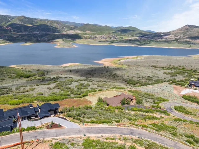 Expansive aerial perspective showcasing a significant body of water and distant mountains