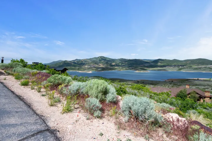 Expansive lake and mountain scenery from a hillside property
