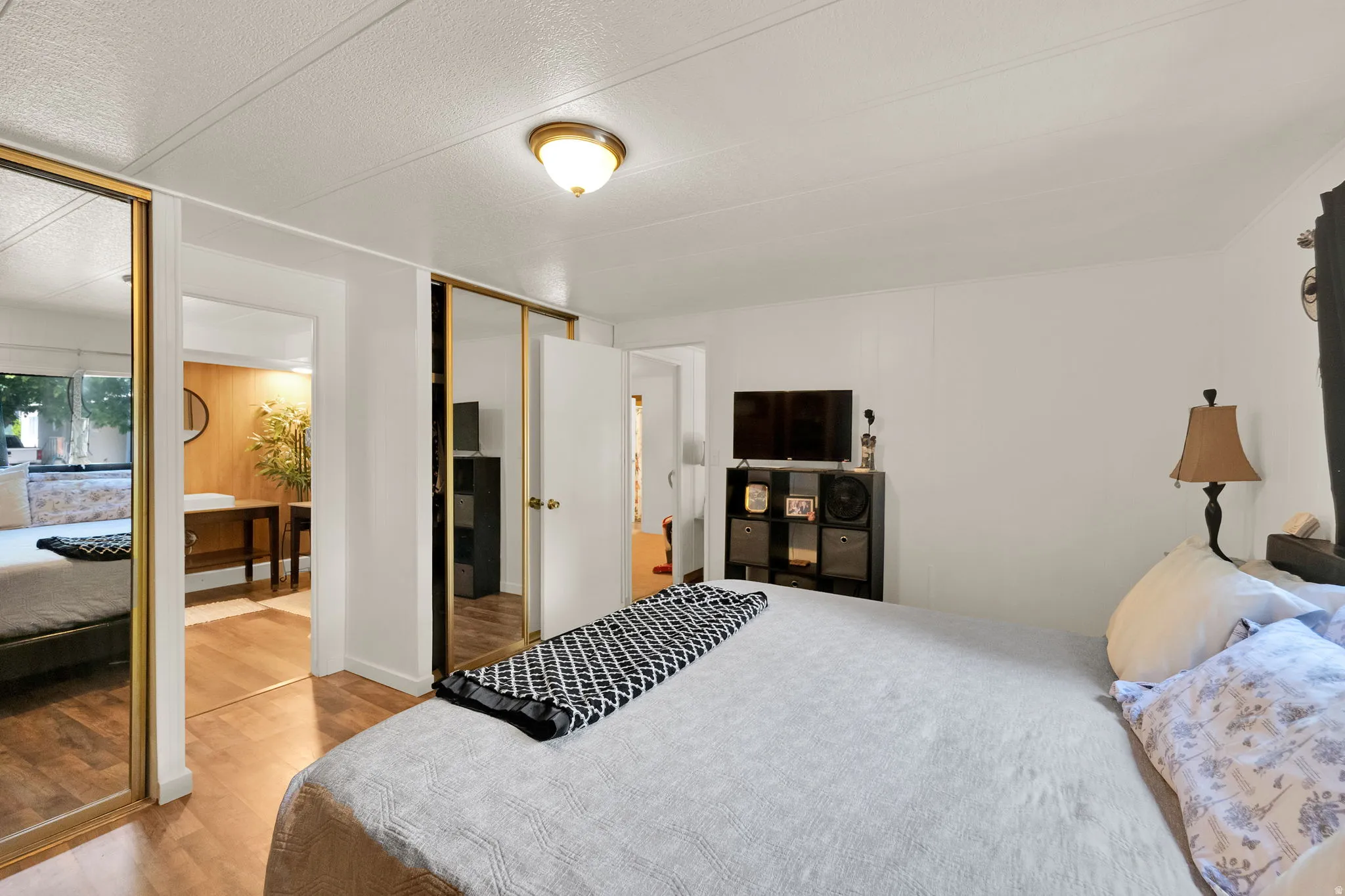 Master Bedroom with white walls and a textured ceiling
