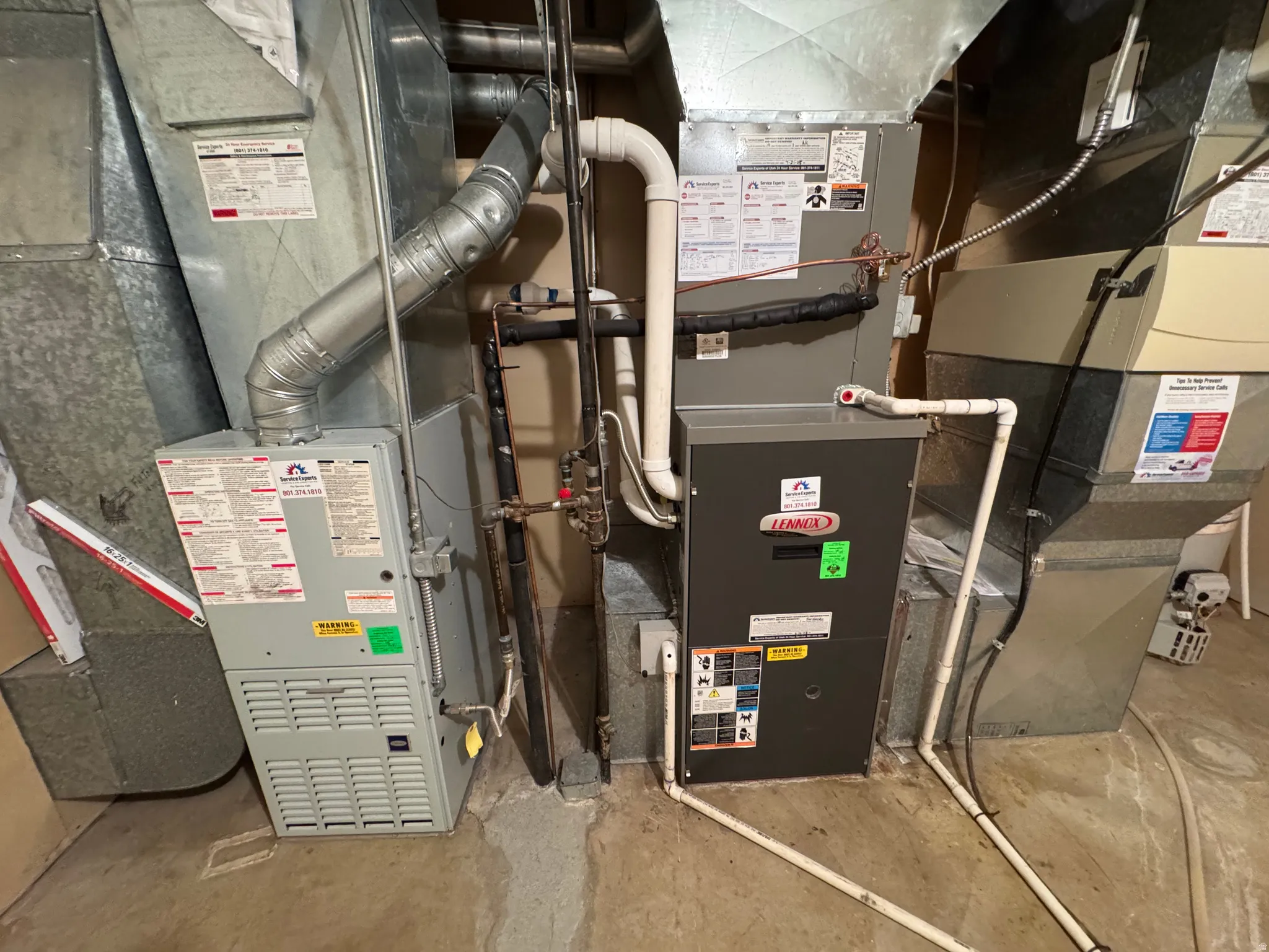 Two forced-air heating and cooling units with associated ductwork and plumbing
