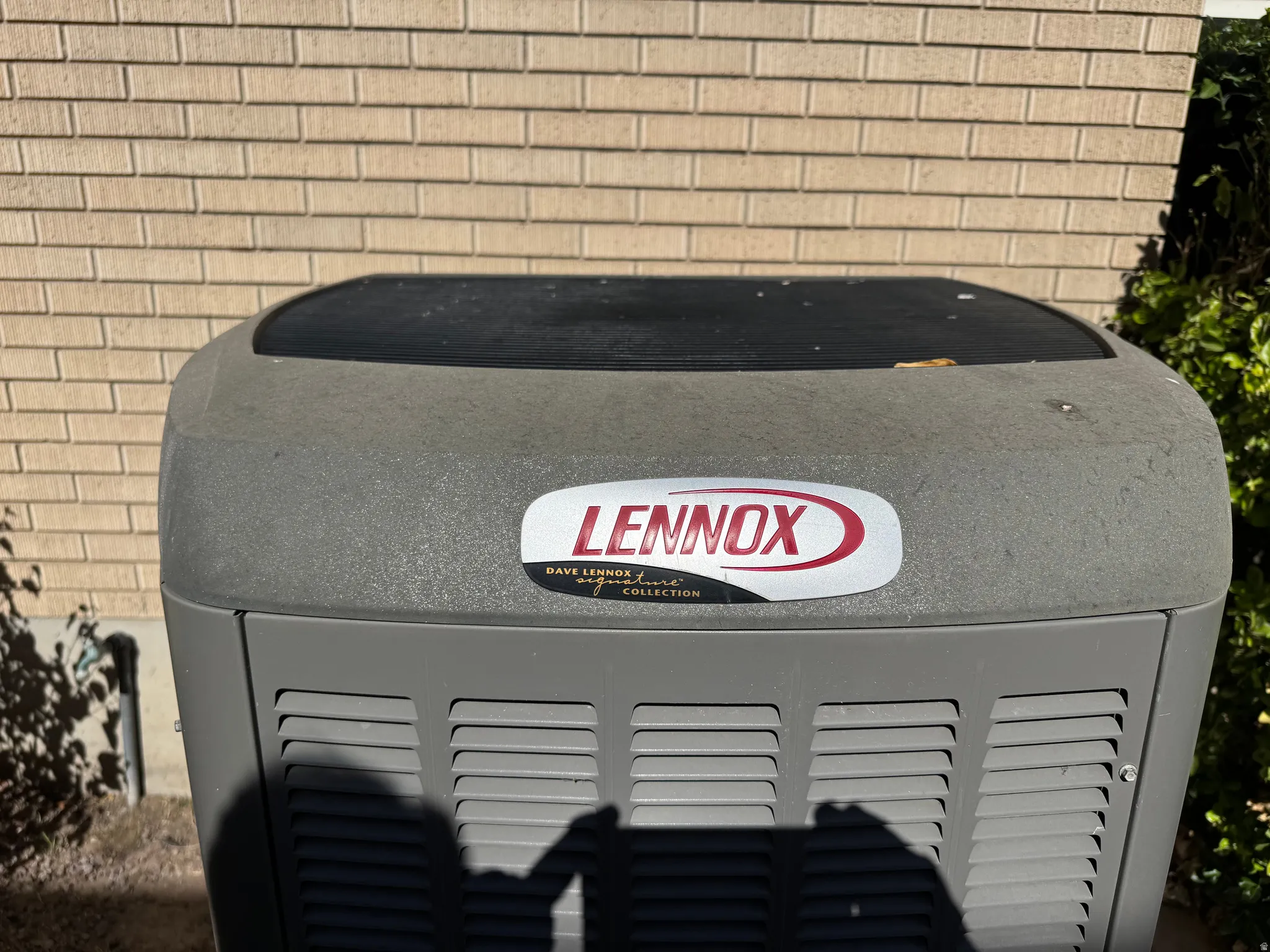 Lennox outdoor HVAC unit featuring a durable gray casing with ventilation grilles