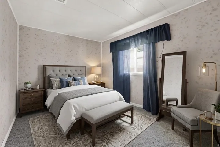 Bedroom featuring a tufted headboard, patterned wallpaper, a window with drapery, and wall-to-wall carpeting