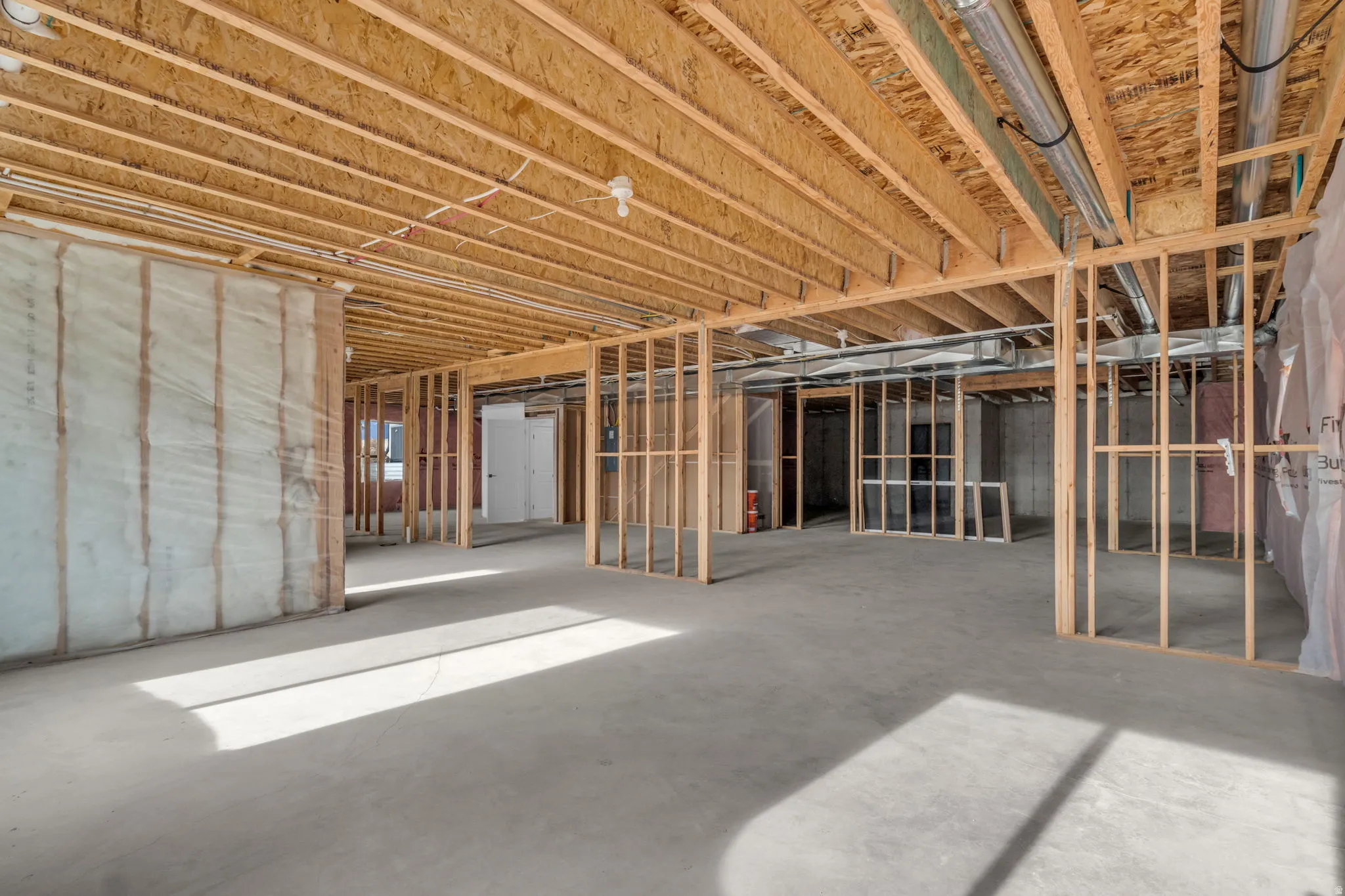 Unfinished basement with potential for large game/theater room, family room, full bathroom and three bedrooms.