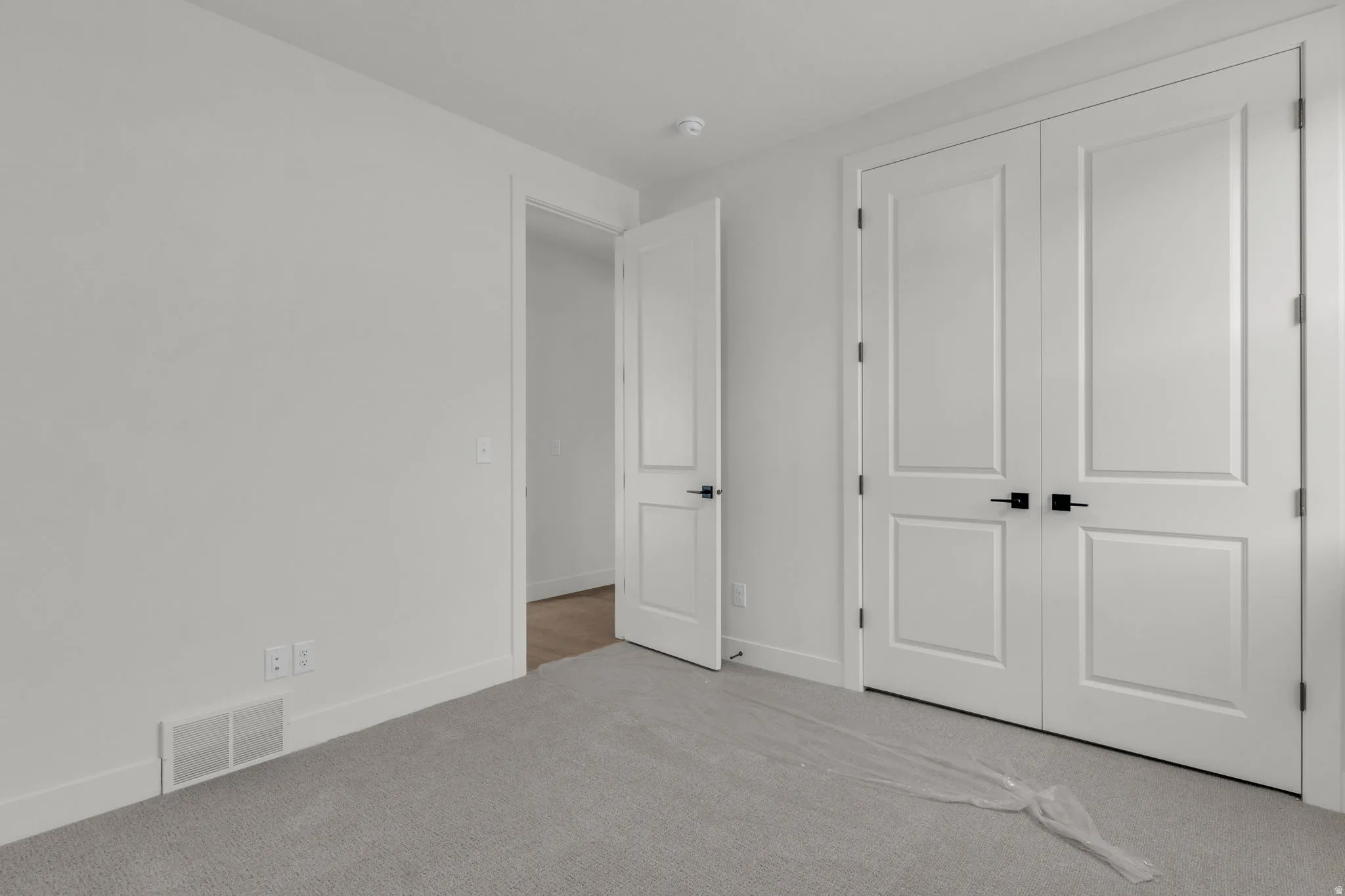 Bedroom #3 with large closet and vaulted ceiling.