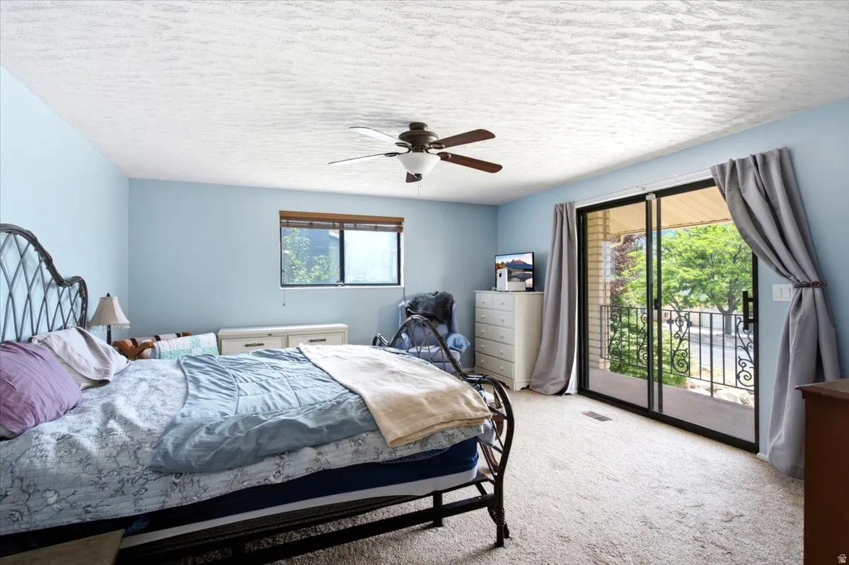 Bedroom featuring carpet flooring and light blue walls