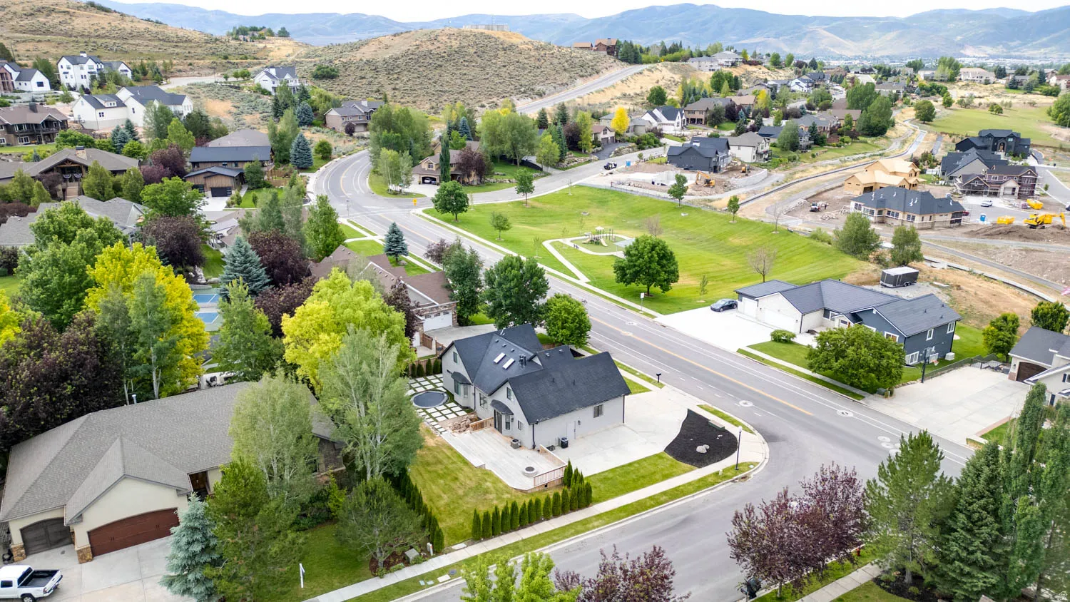 Aerial perspective showcasing a residential neighborhood with varied architectural styles and mature landscaping