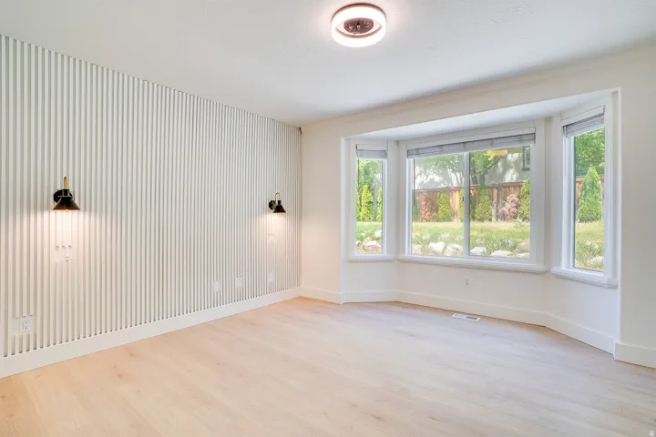Bay window with multiple panes overlooking the exterior grounds