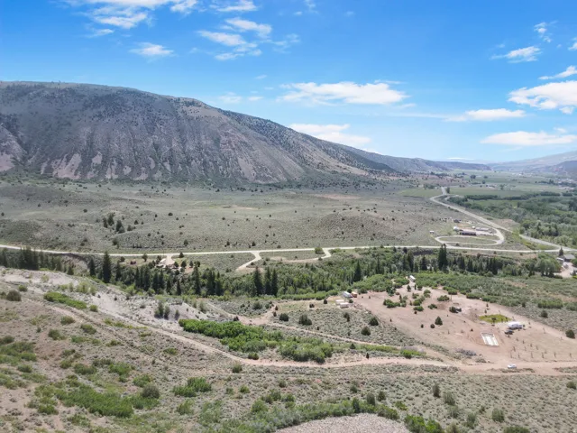 Expansive undeveloped land featuring natural terrain with diverse foliage