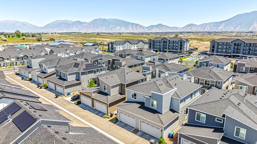New residential development featuring modern detached homes and apartment buildings
