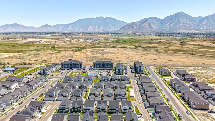 Expansive aerial view showcasing a residential community with varied housing styles