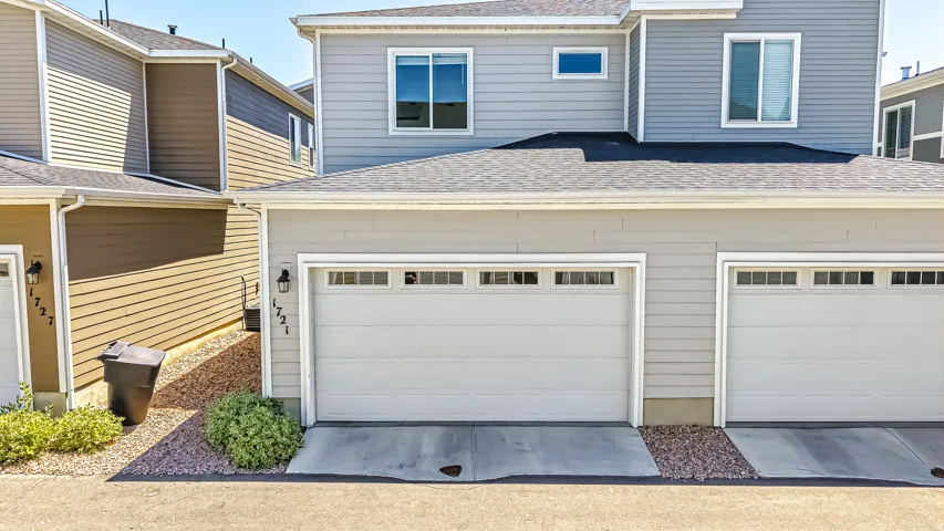 Light gray exterior siding with multiple windows