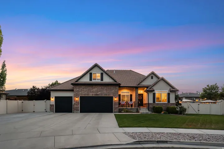 Traditional-style home featuring a brick and stucco exterior