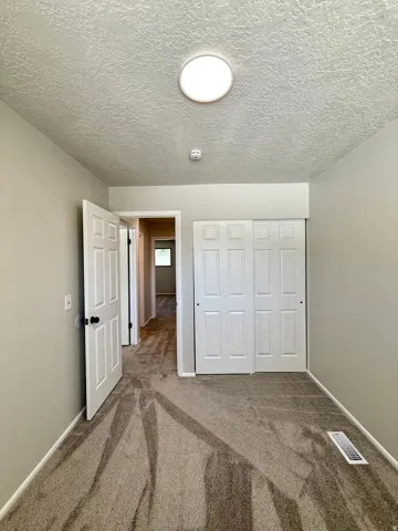 Neutral-toned carpeting throughout