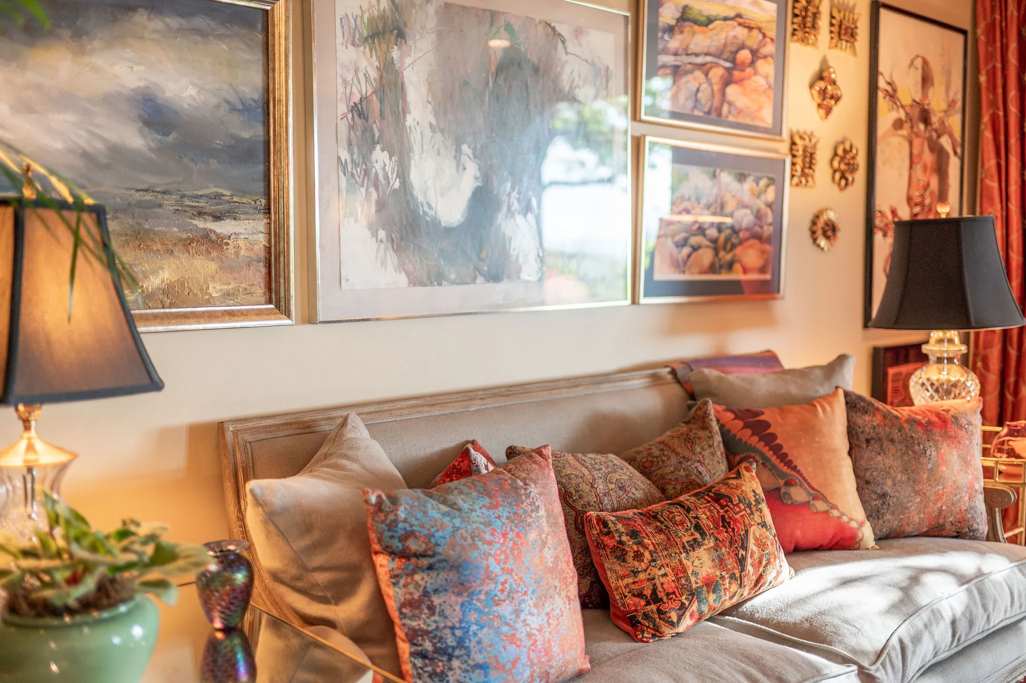 Neutral-toned upholstered sofa with multiple decorative pillows