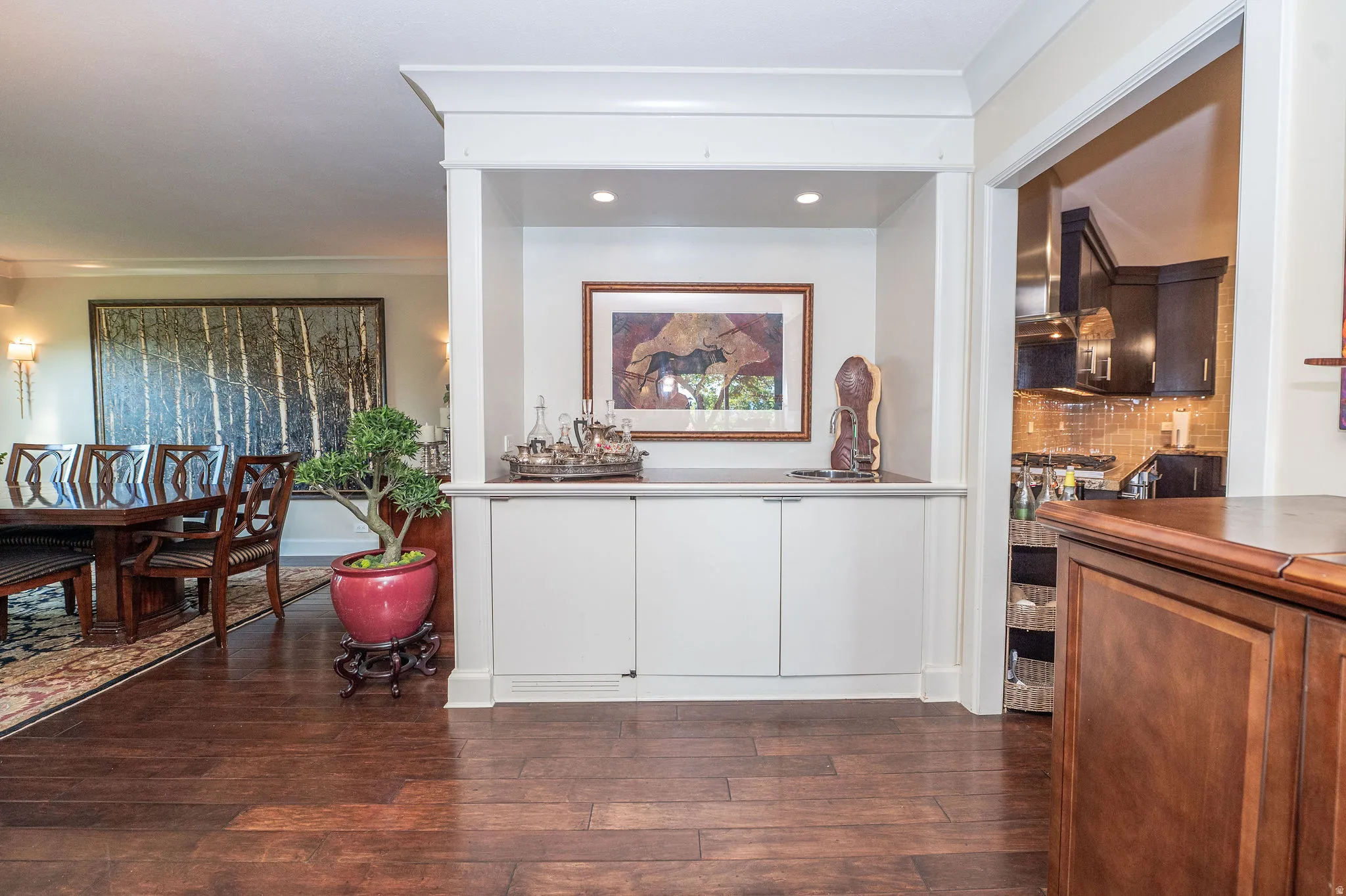 Built-in cabinetry with recessed lighting and a contrasting countertop