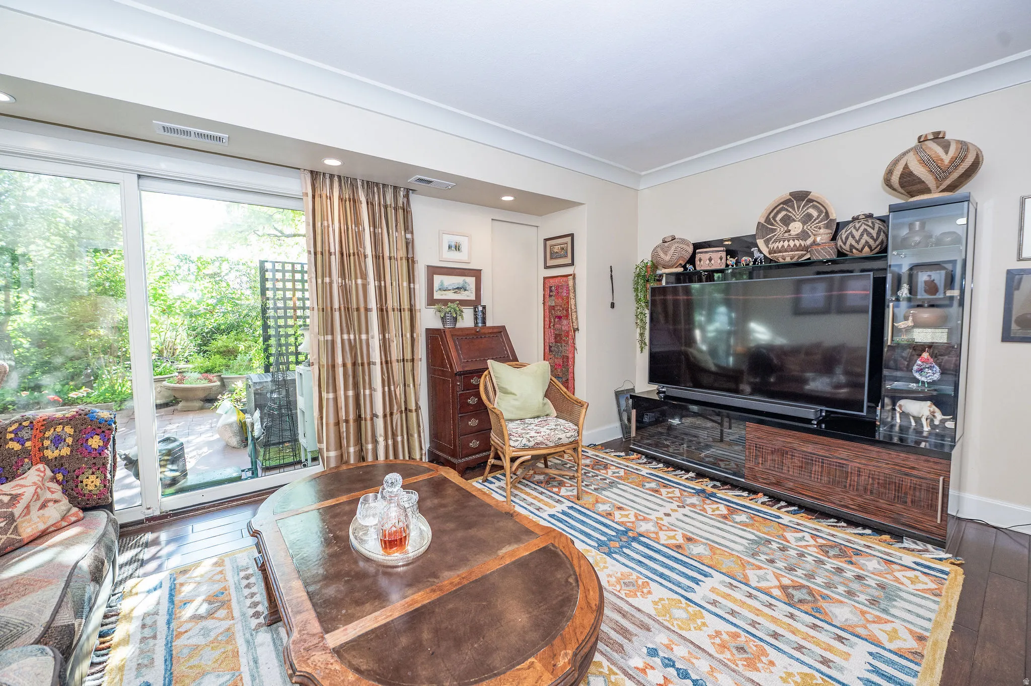Interior space featuring dark wood-finish flooring and crown molding