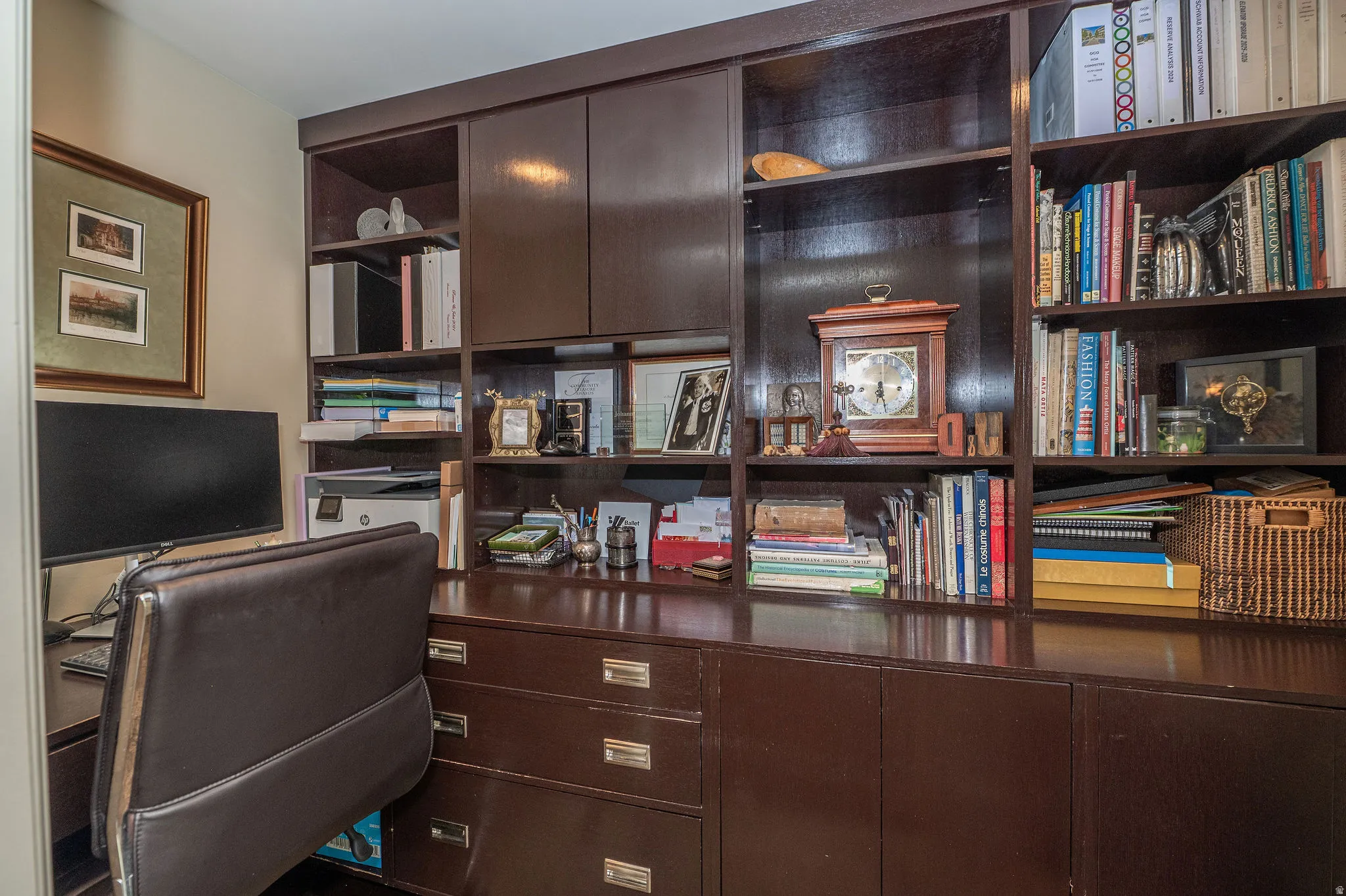 Custom built-in cabinetry and shelving featuring a rich wood finish