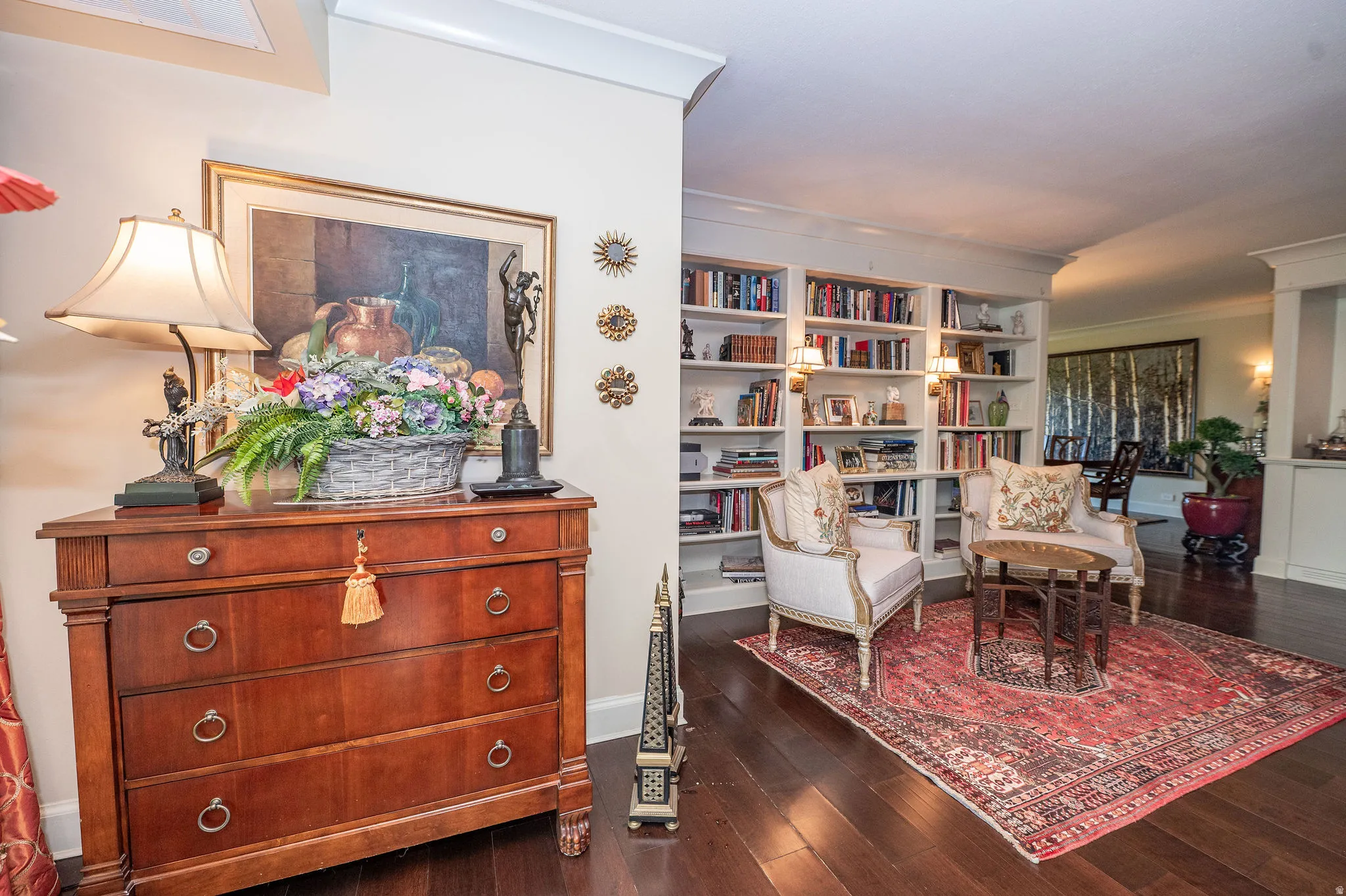Interior space featuring dark wood-finish flooring and white crown molding