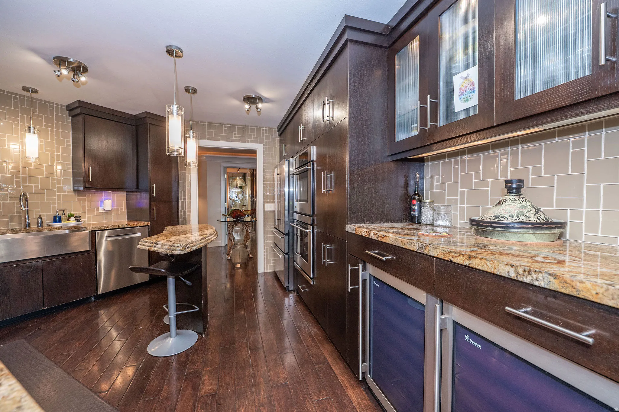 Gourmet kitchen featuring rich wood-finish cabinetry, stainless steel appliances, and abundant counter space