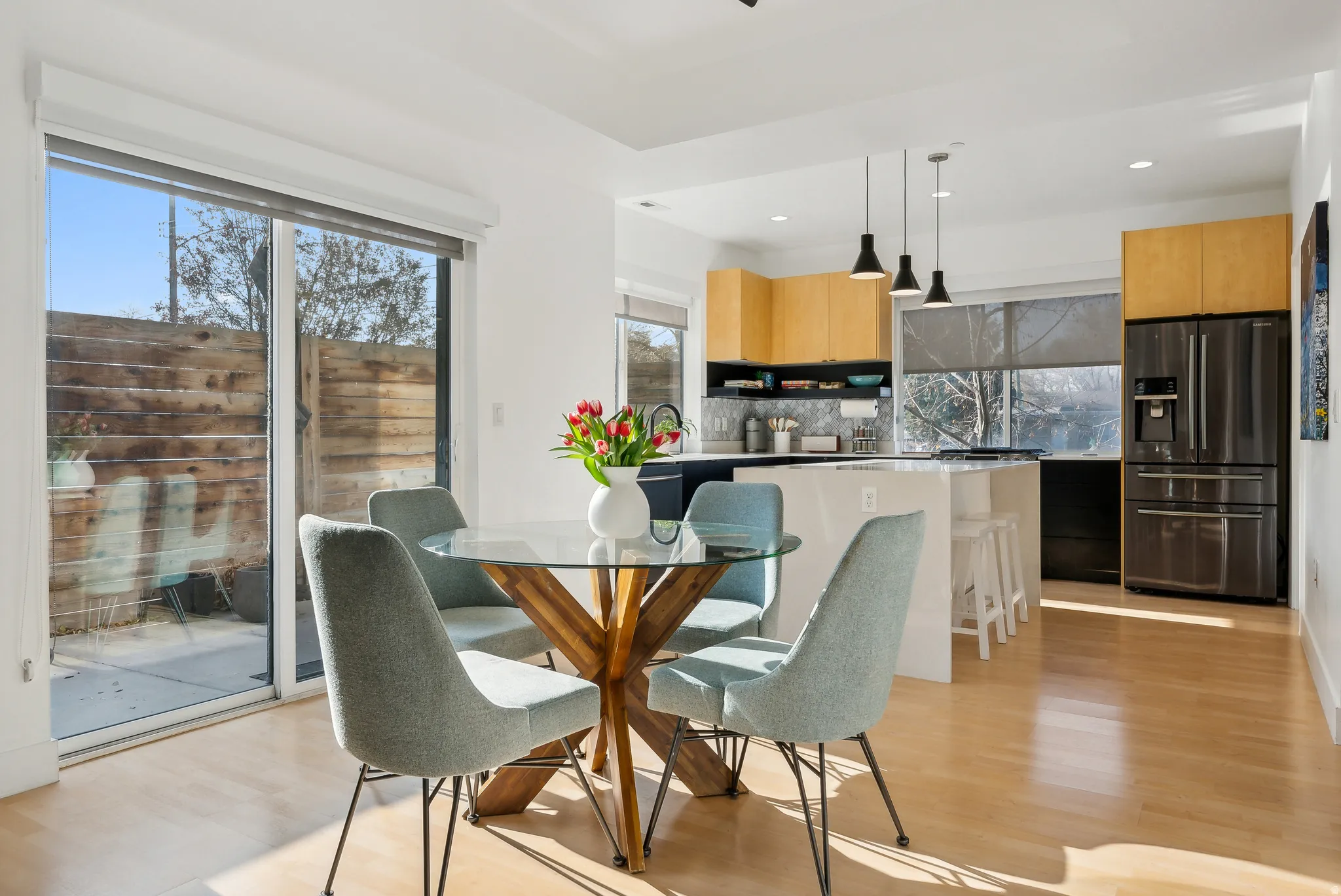 Open-concept kitchen and dining area with hardwood flooring