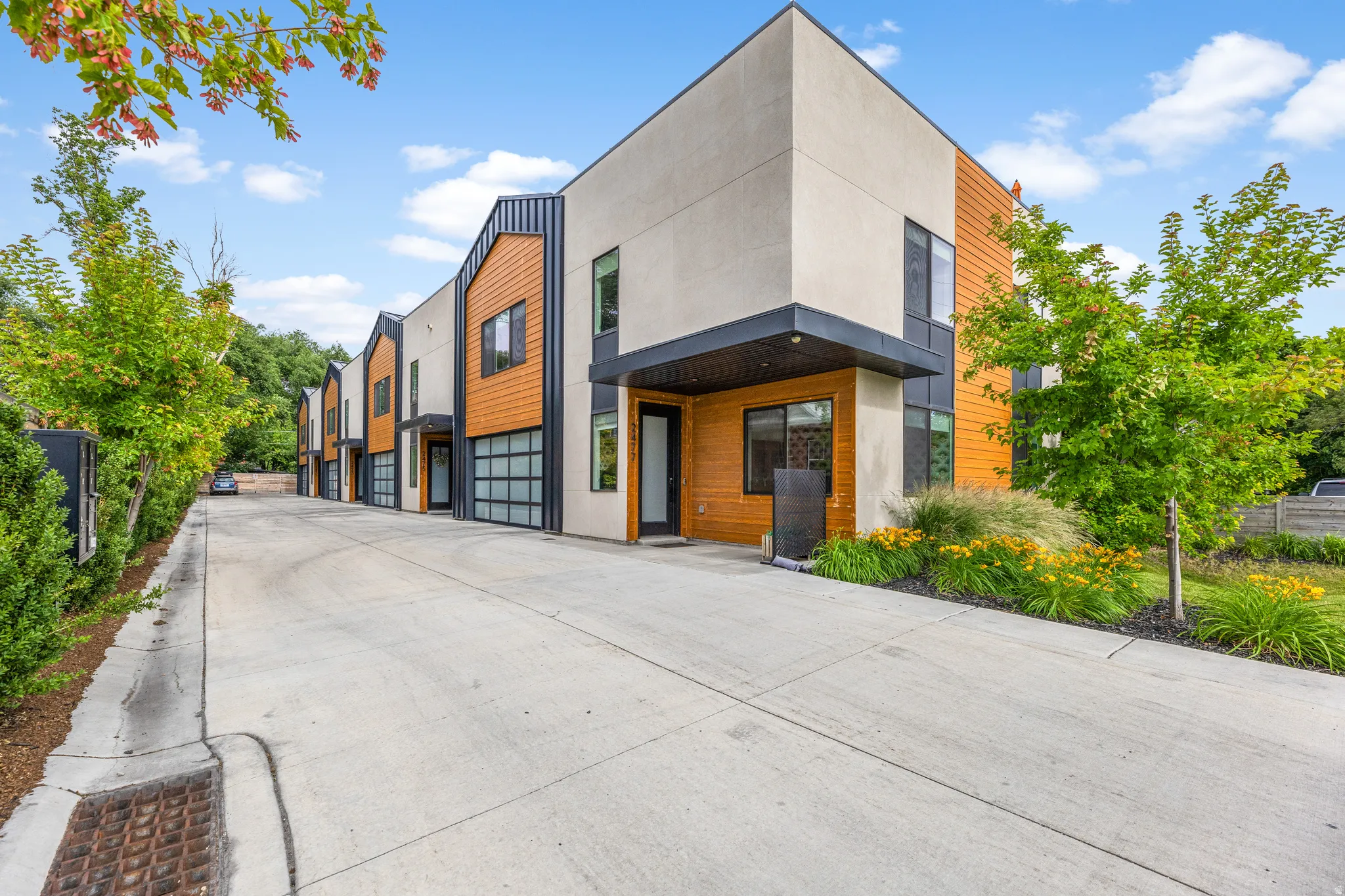 Modern multi-unit property with a concrete drive