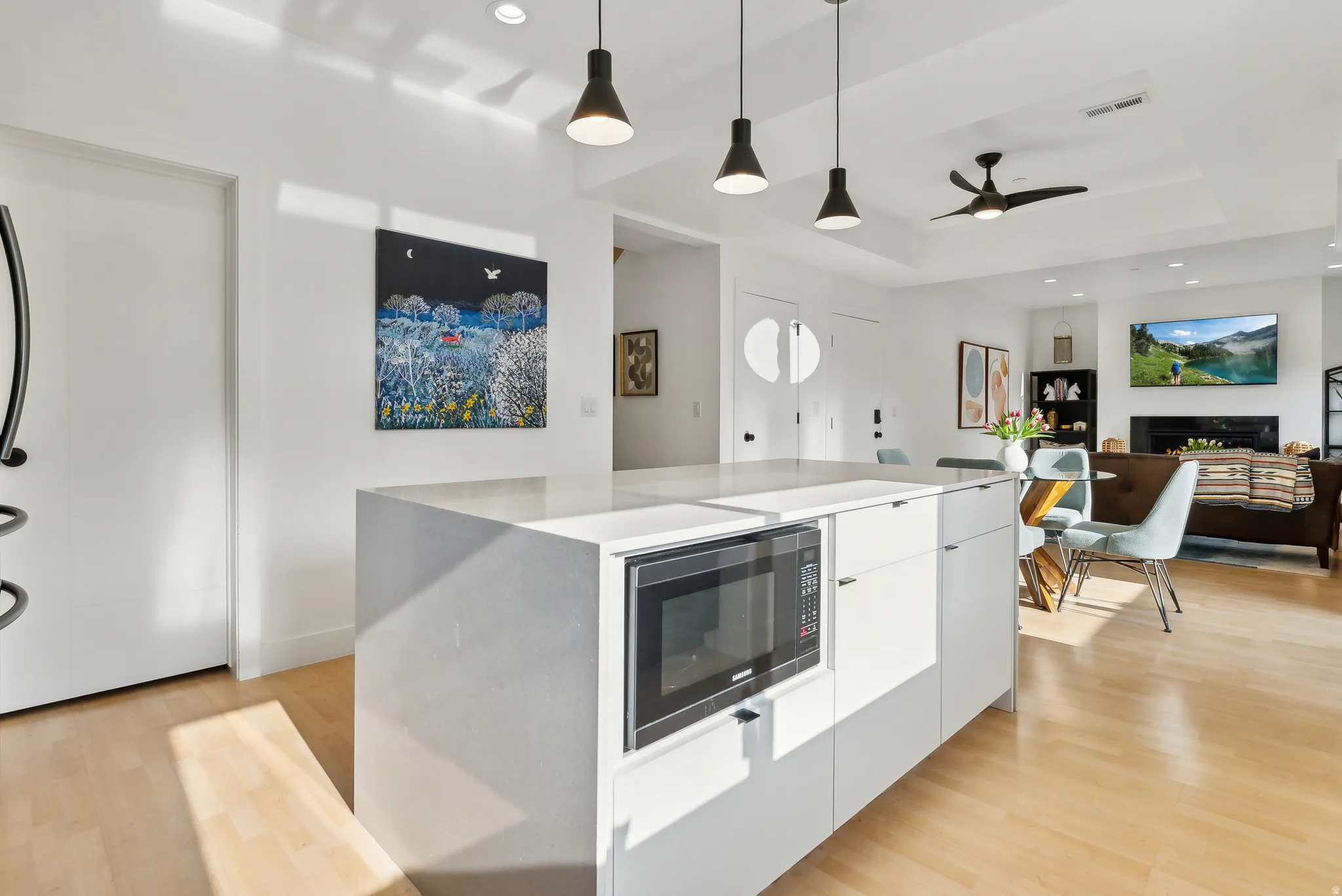 Kitchen island featuring a built-in microwave and integrated storage