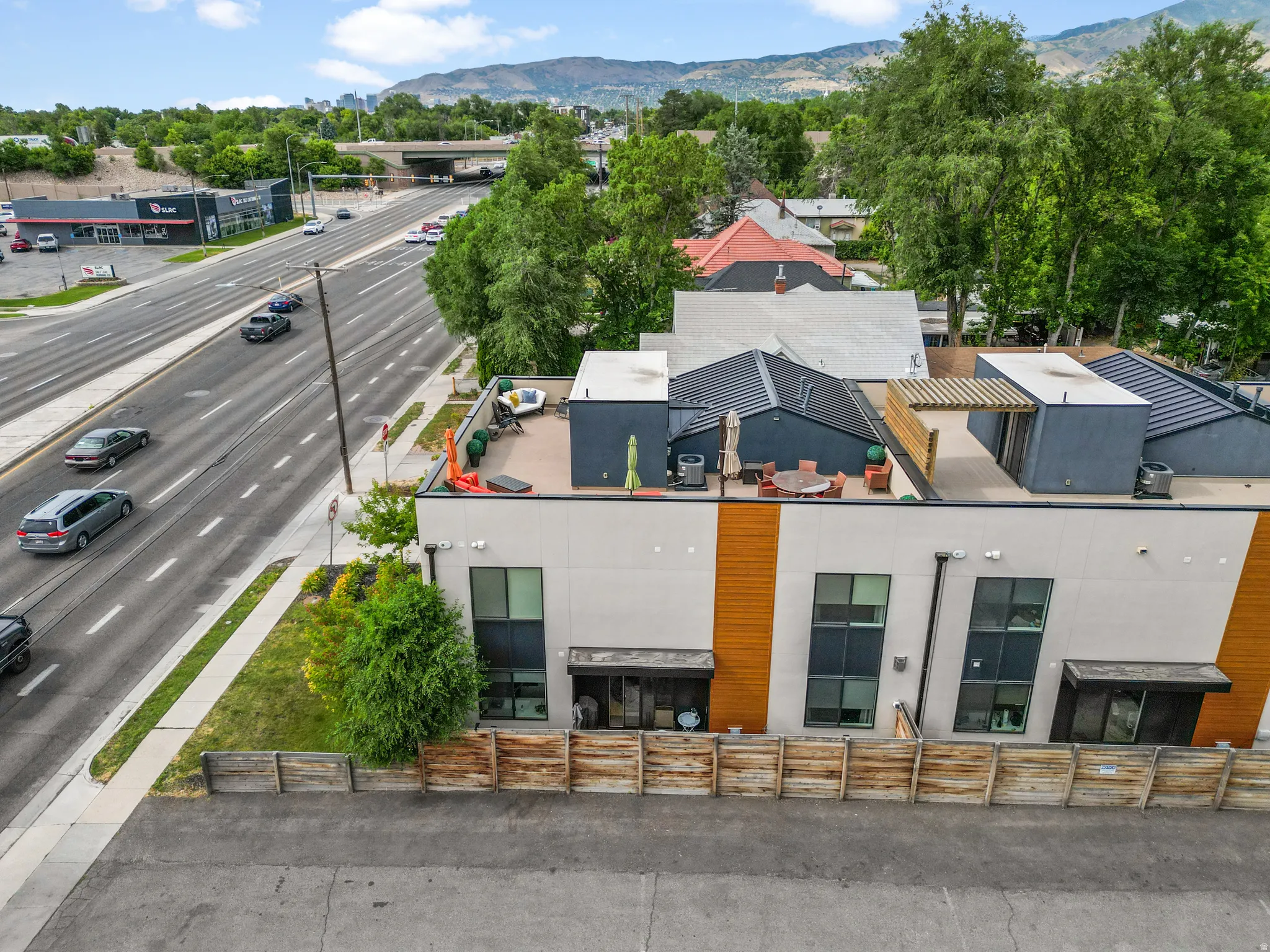 Modern facade featuring clean lines and wood-tone accent panels