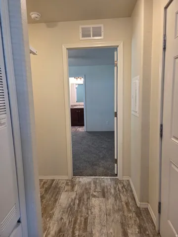 Laundry room off of the hallway, between the kitchen and the master bedroom.