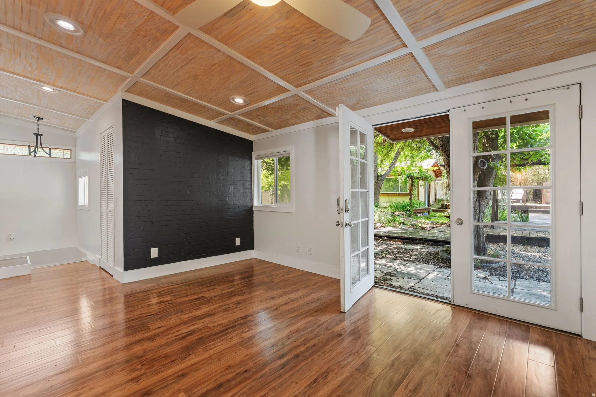 Garden Bedroom with French doors leading to garden backyard area