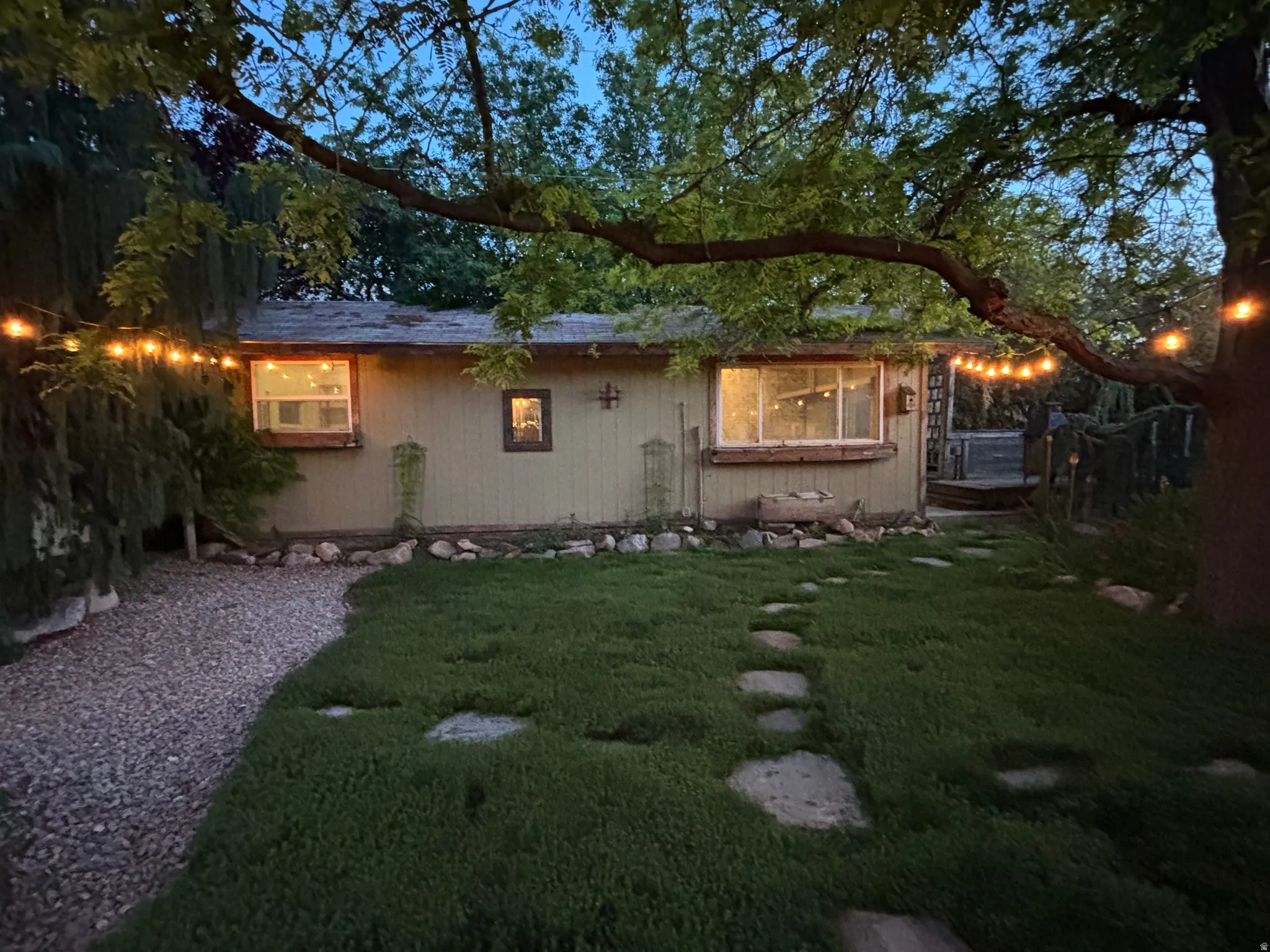 Exterior view of workshop and water wise alternative lawn that blends thyme, micro clover, and drought resistant grass.  It is self fertilizing and low maintenance