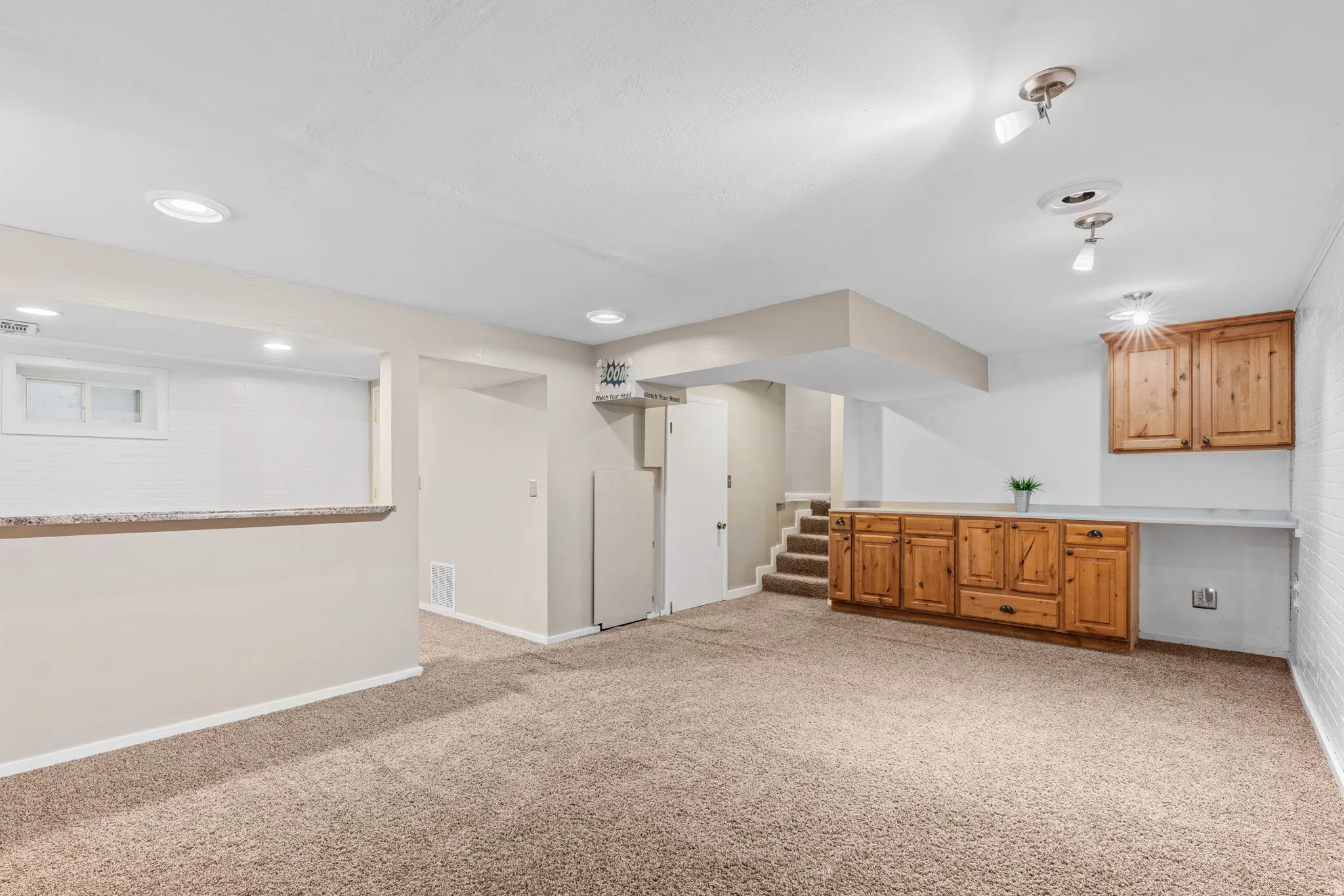 Lower level room featuring carpet flooring and recessed lighting