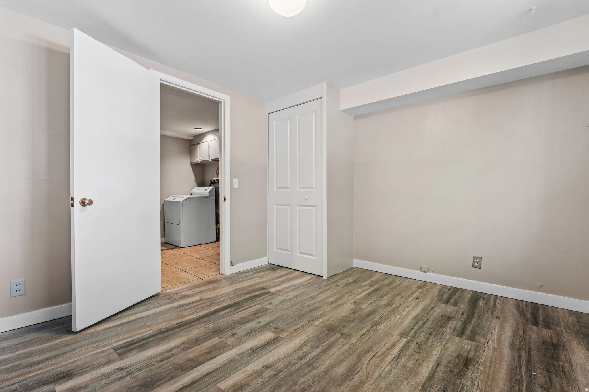 Light-colored walls complement the wood-finish flooring
