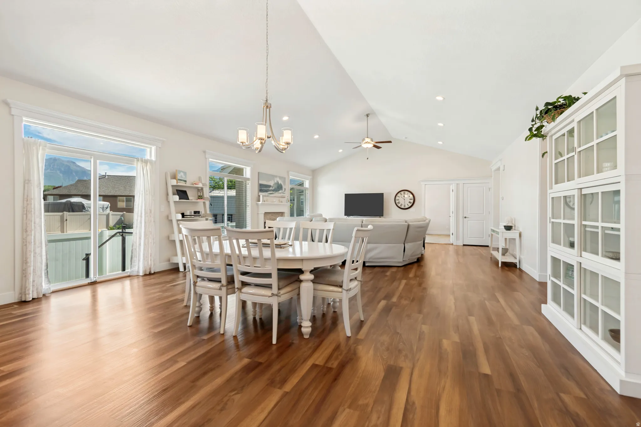 Spacious interior featuring wood-finish flooring, vaulted ceilings, and recessed lighting