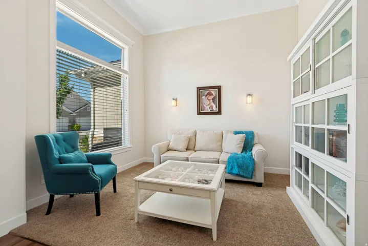 Vaulted ceilings complement the large picture window, offering abundant ambient light
