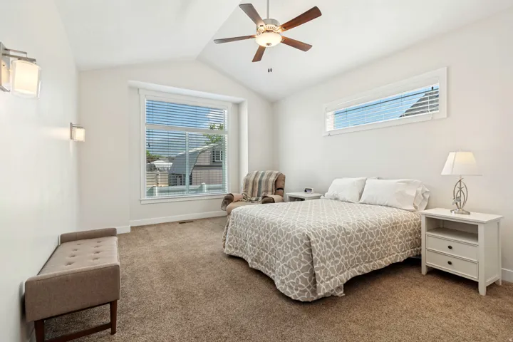 Vaulted ceiling featuring a ceiling fan with integrated lighting
