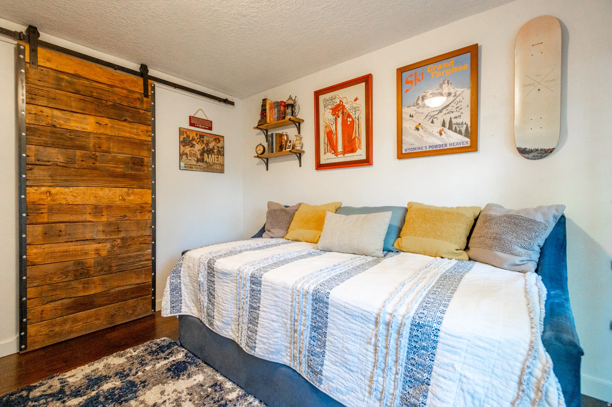 Reclaimed wood barn door with black iron hardware