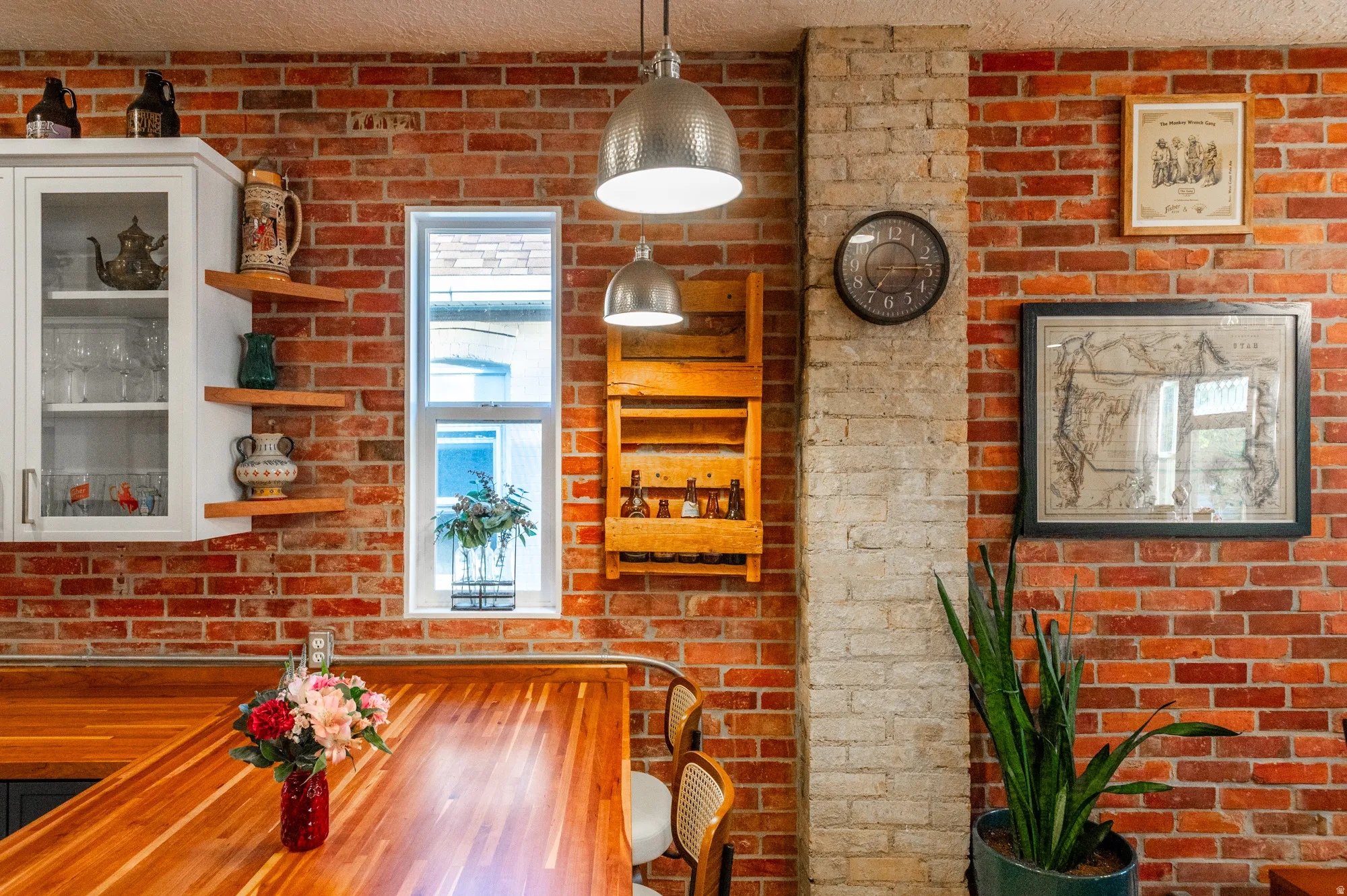 Exposed brick walls featuring an integrated light brick column
