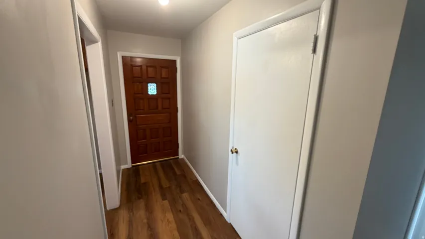 Entryway with nice wood entry door with decorative glass insert
