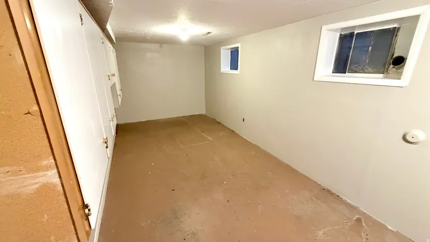 Huge Storage/Utility Room with cabinetry