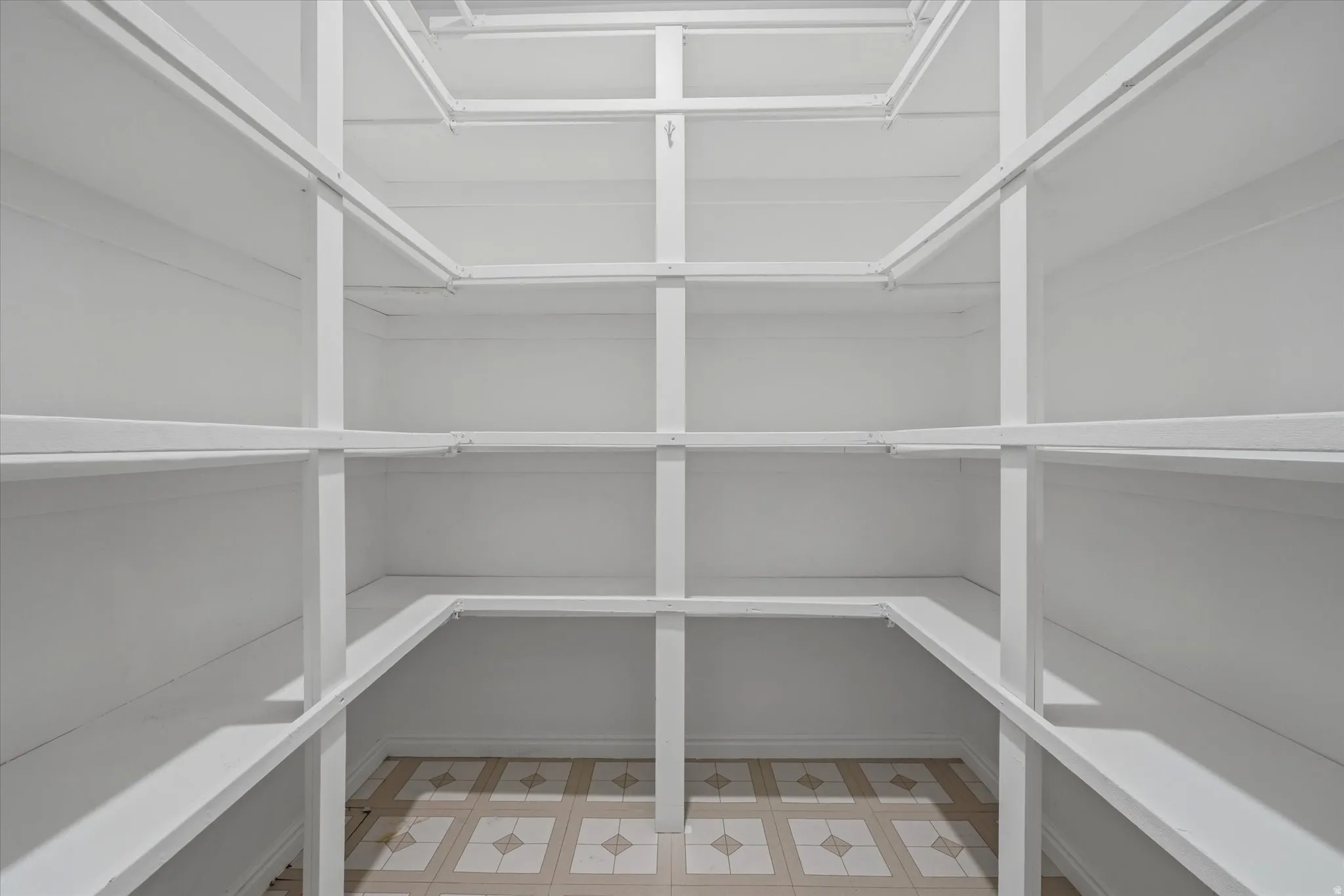 Built-in shelving system with white finish