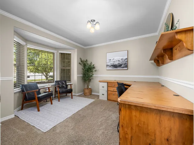 Office with built in desk and shelf.