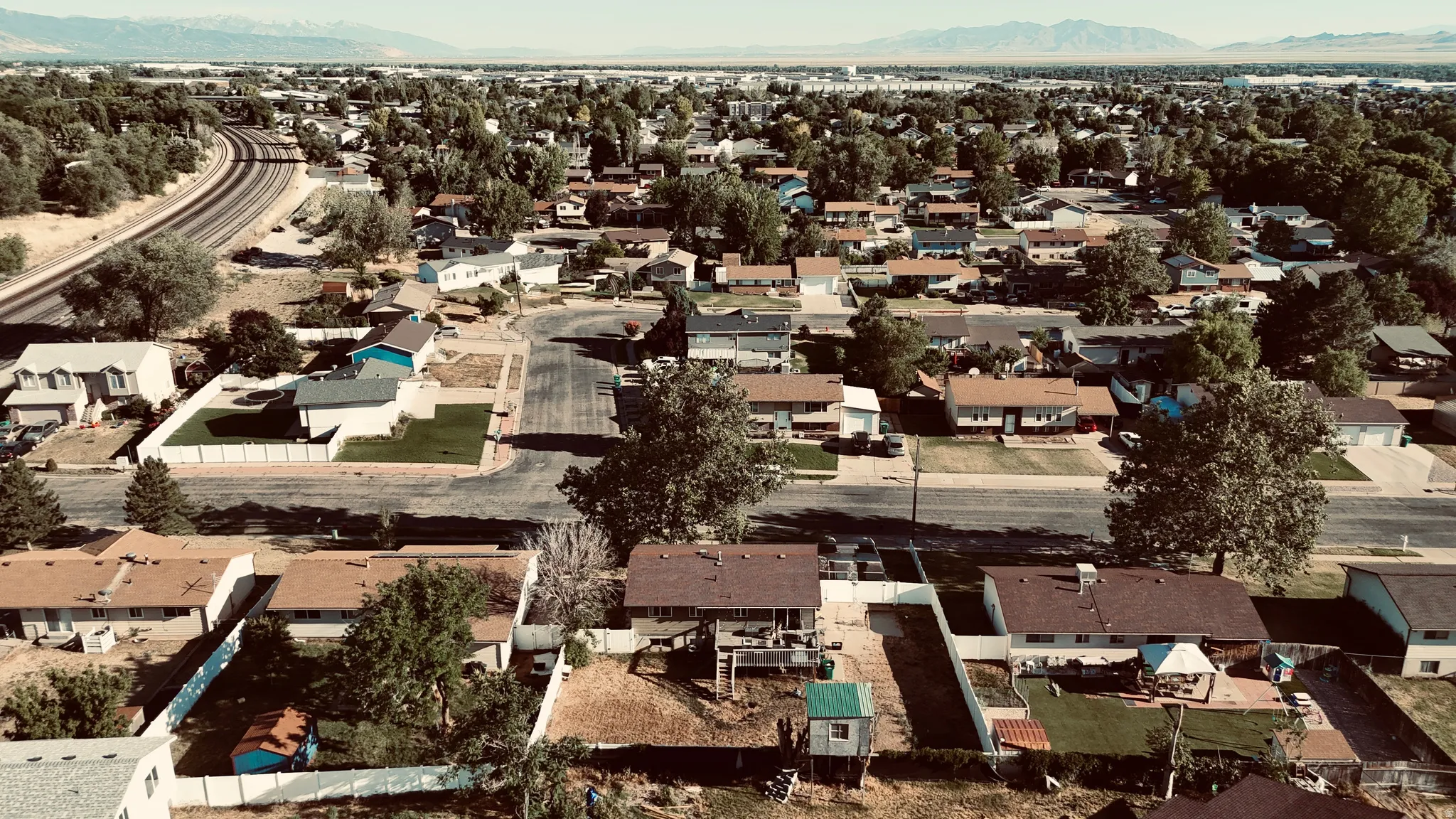 Aerial perspective showcasing a residential neighborhood with varied single-story and two-story homes